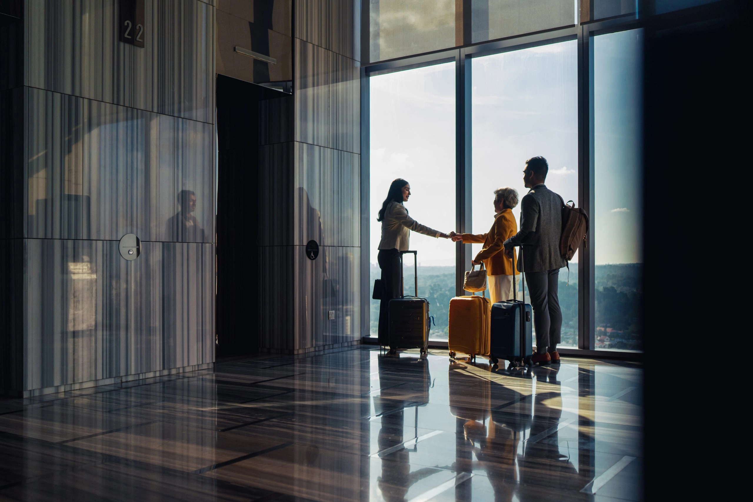 Traveling business executives in hotel lobby